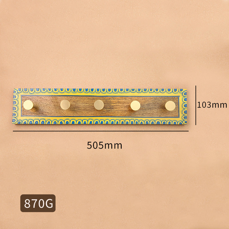 Vintage brass hook in wood